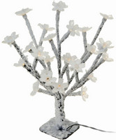 Stromek s květy svítící s umělým sněhem